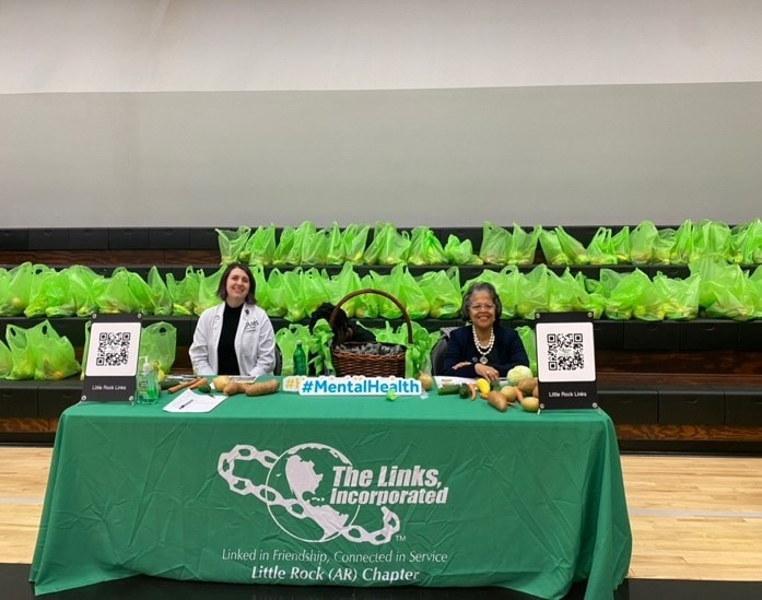 two people sitting at the Links table